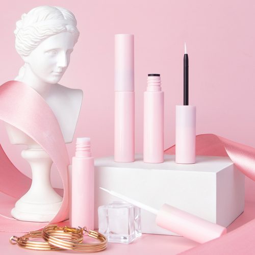 5ml Glossy Pink Plastic Empty Tube for Lash Glue, decorative styled product shot of pink empty eyeliner lash serum packaging tubes