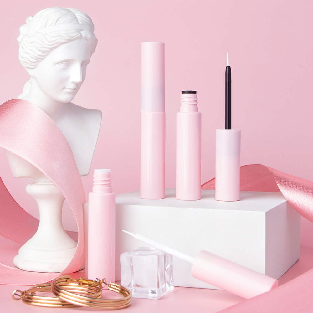 5ml Glossy Pink Plastic Empty Tube for Lash Glue, decorative styled product shot of pink empty eyeliner lash serum packaging tubes